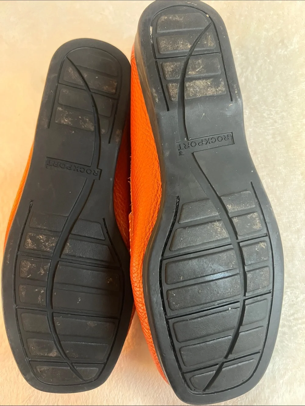 Rockport women’s orange pebbled leather square toe penny loafers